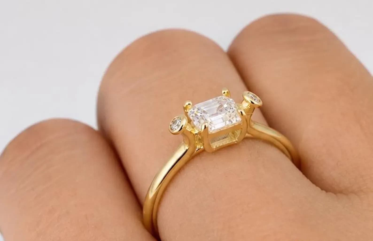 An emerald-cut solitaire ring